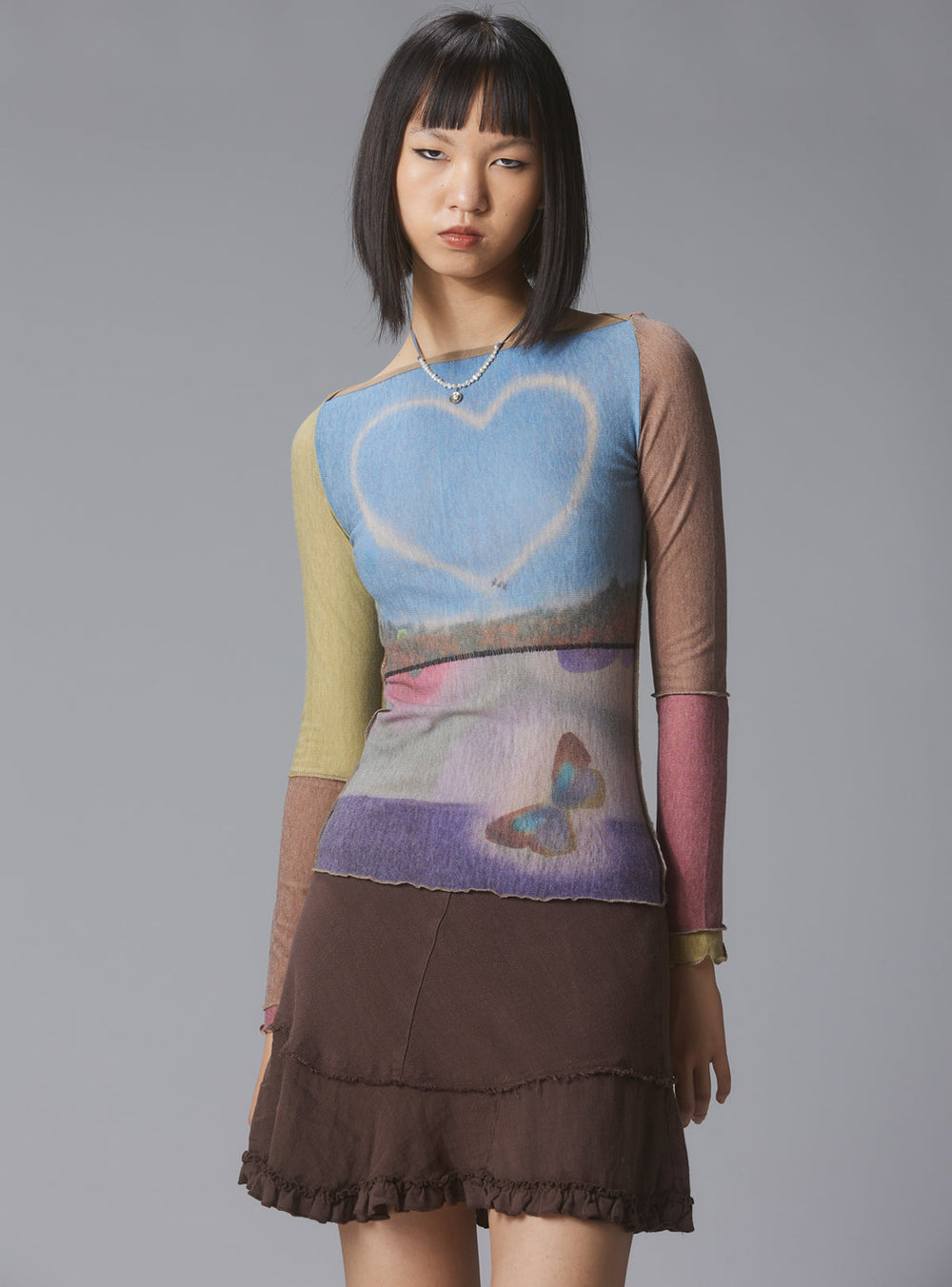 Skye Top Y2K allover-print mesh top with custom artwork - Multi | UNIF Clothing near me