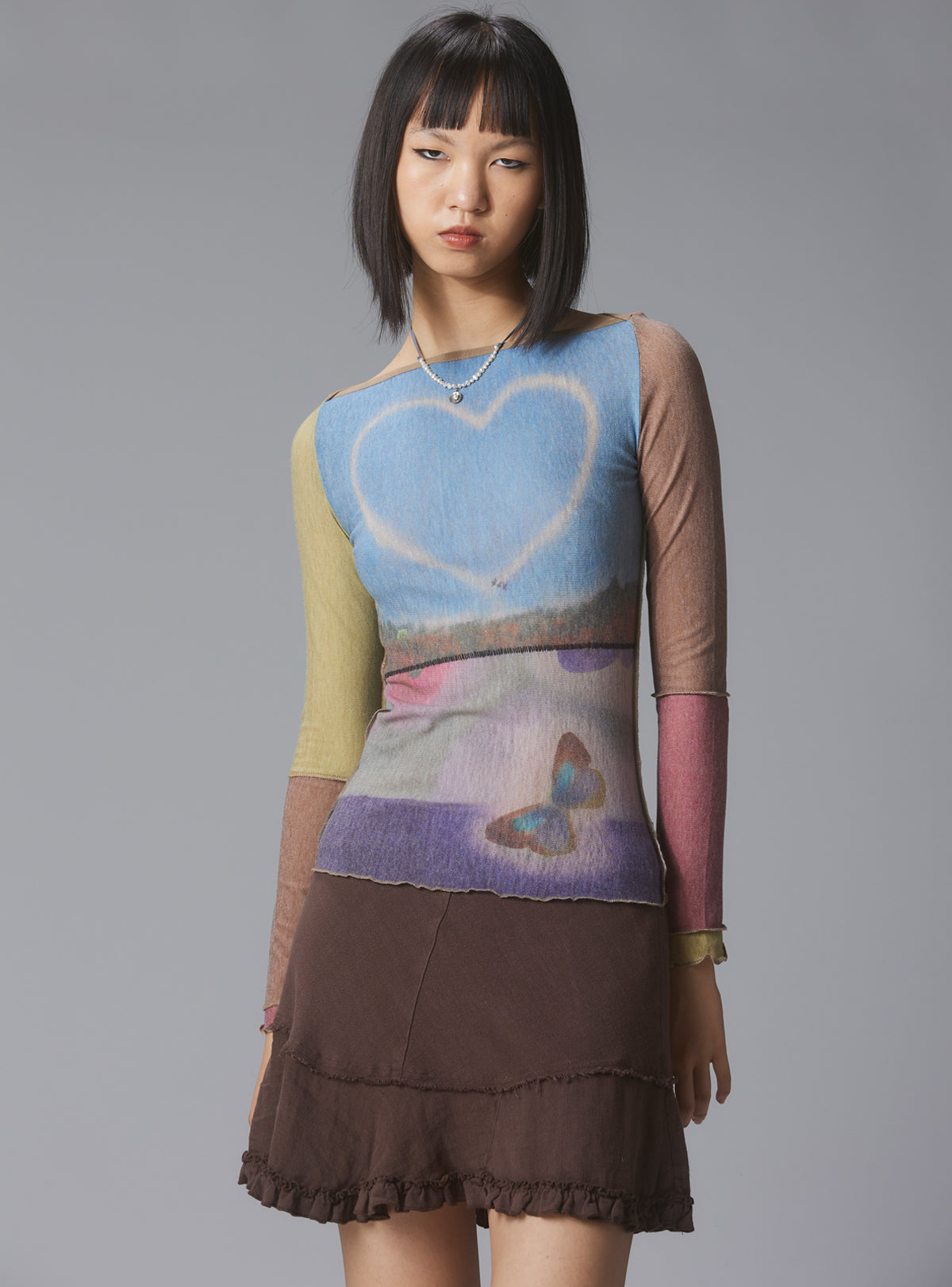 Skye Top Y2K allover-print mesh top with custom artwork - Multi | UNIF Clothing near me