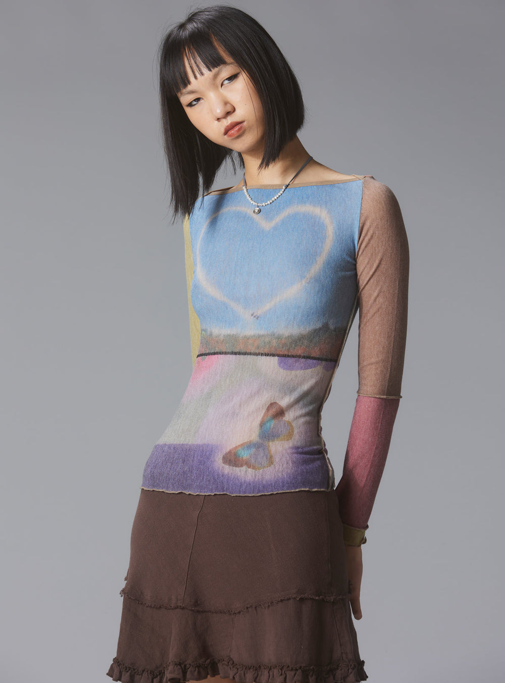 Skye Top Y2K allover-print mesh top with custom artwork - Multi | UNIF Clothing near me